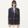 Chaqueta de lino de botonadura sencilla con bordados de abalorios y parches Chaqueta de lino de botonadura sencilla con bordados de abalorios y parches