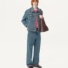 Chaqueta vaquera con bordados de abalorios y bordes estampados Chaqueta vaquera con bordados de abalorios y bordes estampados