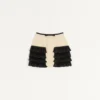 Falda corta de tweed de lana liso