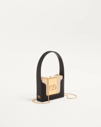 Minaudière Minaumorphe de Valentino Garavani en metal con cristales Swarovski® y estuche de satén