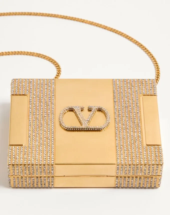 Minaudière Minaumorphe de Valentino Garavani en metal con cristales Swarovski® y estuche de satén