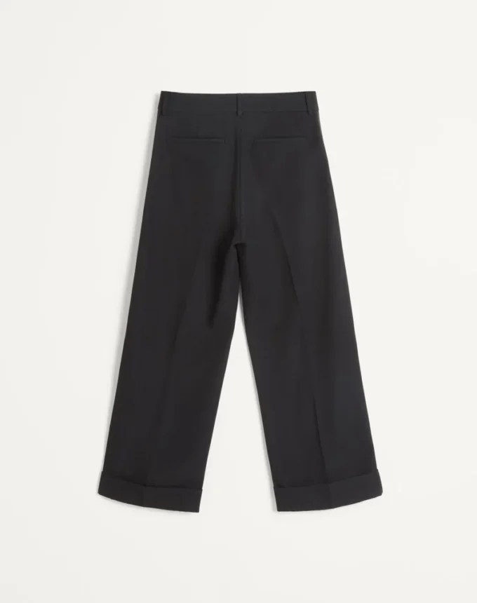 Pantalones de lana con puños y bandas laterales de satén