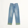 Pantalones vaqueros con ribetes jacquard Pantalones vaqueros con ribetes jacquard