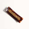 Pinza para el pelo con el logotipo Vlogo en resina, metal y cristales Pinza para el pelo con el logotipo Vlogo en resina, metal y cristales