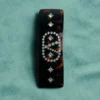 Pinza para el pelo con el logotipo Vlogo en resina, metal y cristales Pinza para el pelo con el logotipo Vlogo en resina, metal y cristales