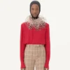 Top de georgette con plumas Top de georgette con plumas