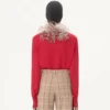 Top de georgette con plumas Top de georgette con plumas