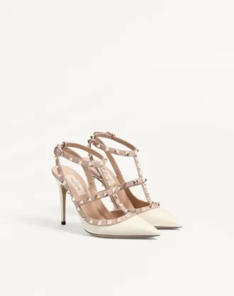 Zapatos de salón con tacón de 100 mm y adornos Rockstud en charol